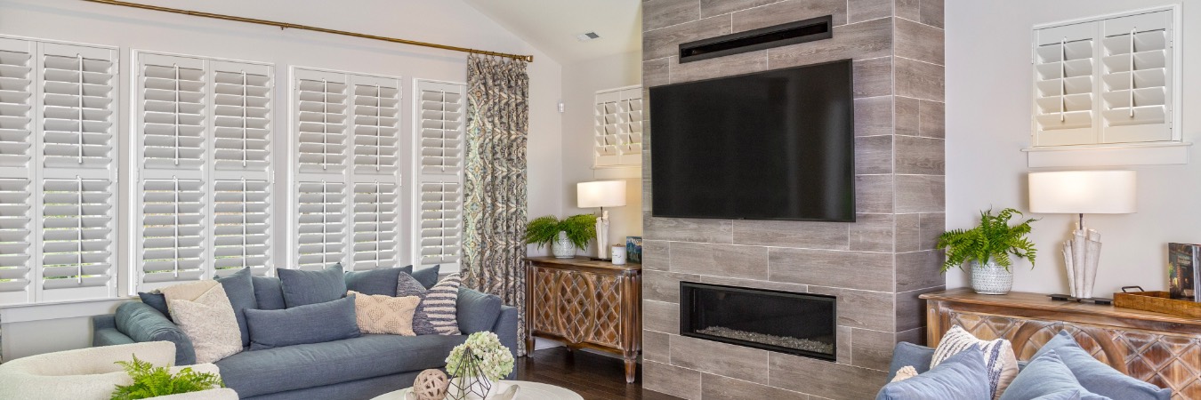 Interior shutters in Poquoson living room with fireplace